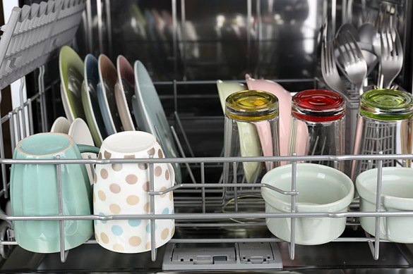 Open dishwasher with dishes in rack